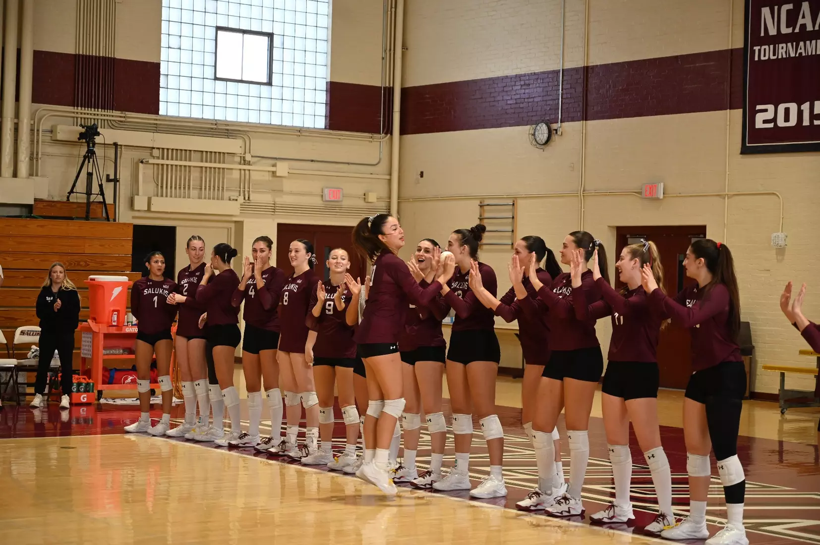 Valentina Zevallos high fives her teammates as her name is announced.