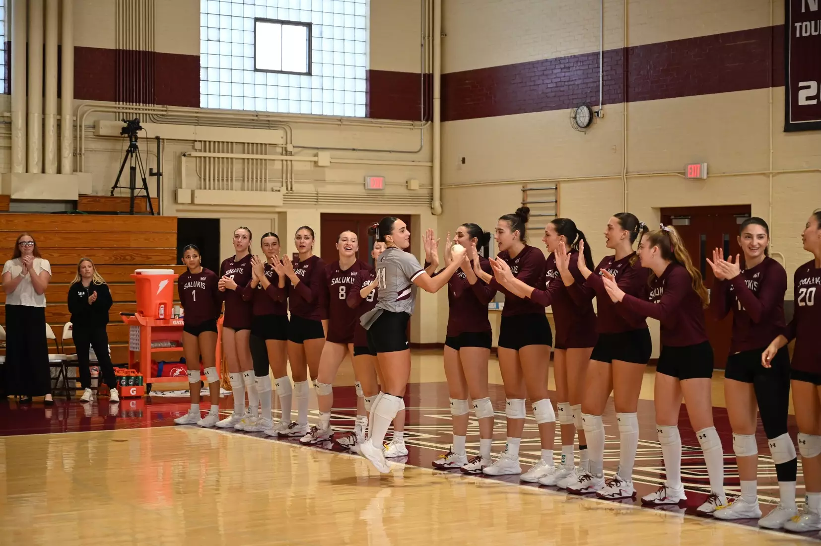 Jillian Shaneyfelt high fives her teammates after her name is announced.