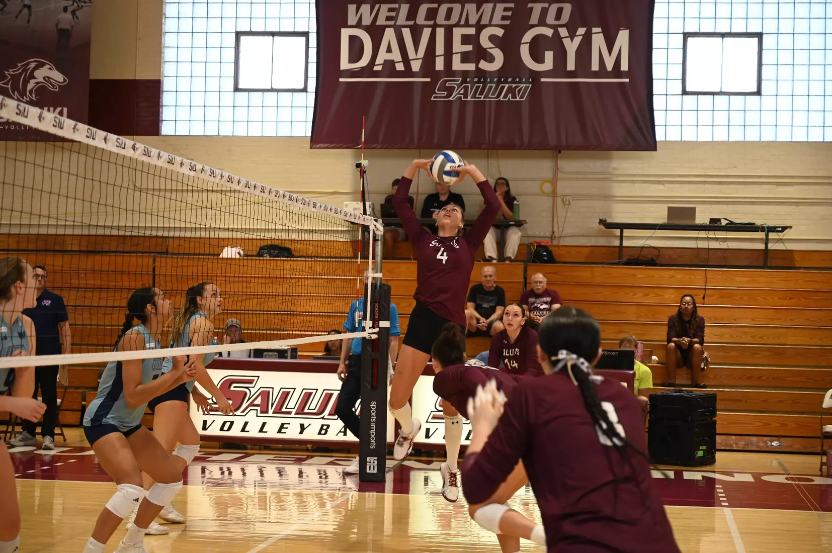 Ella McFarland sets a ball.