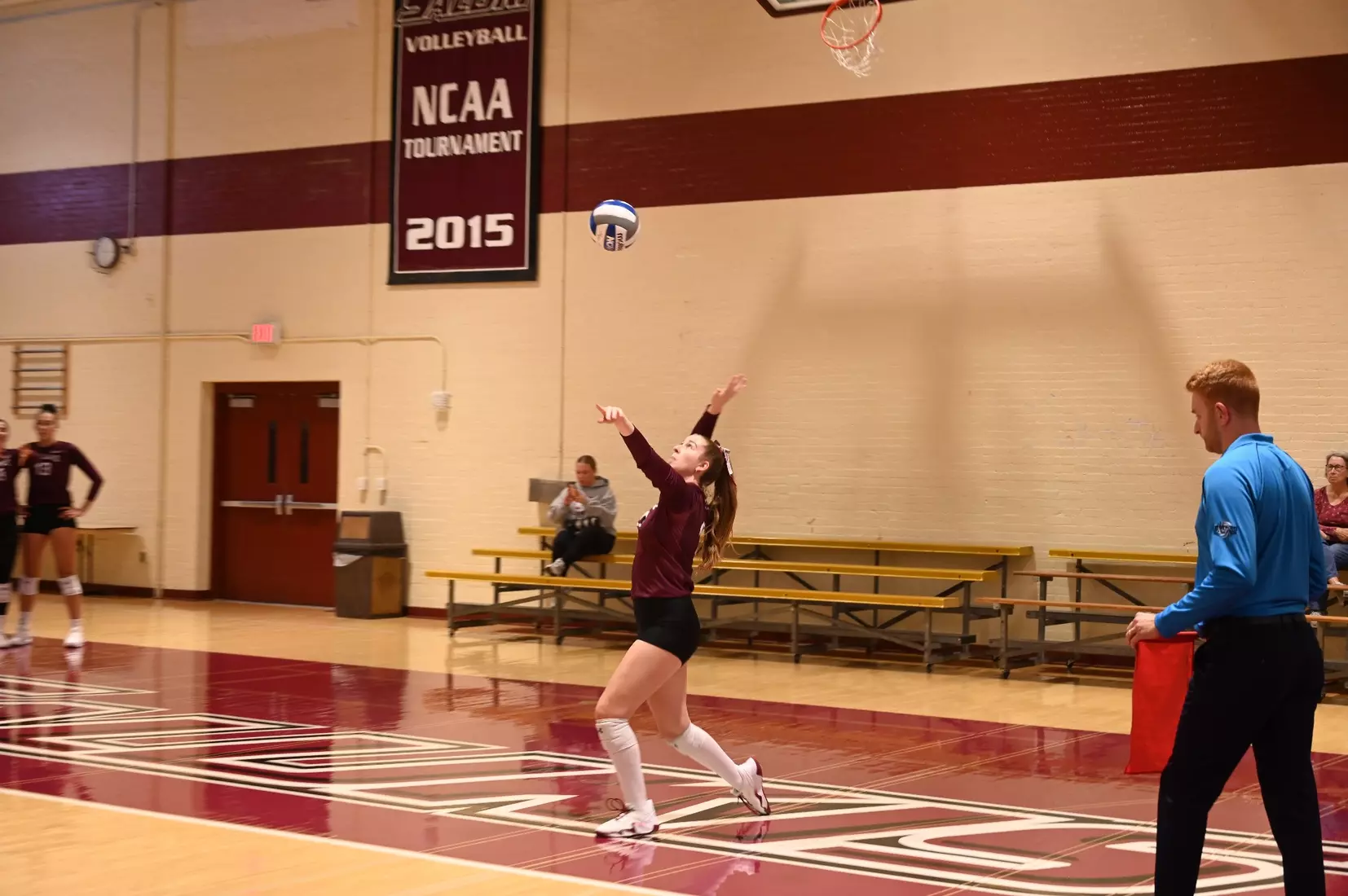 Julia Laidig serves a ball.