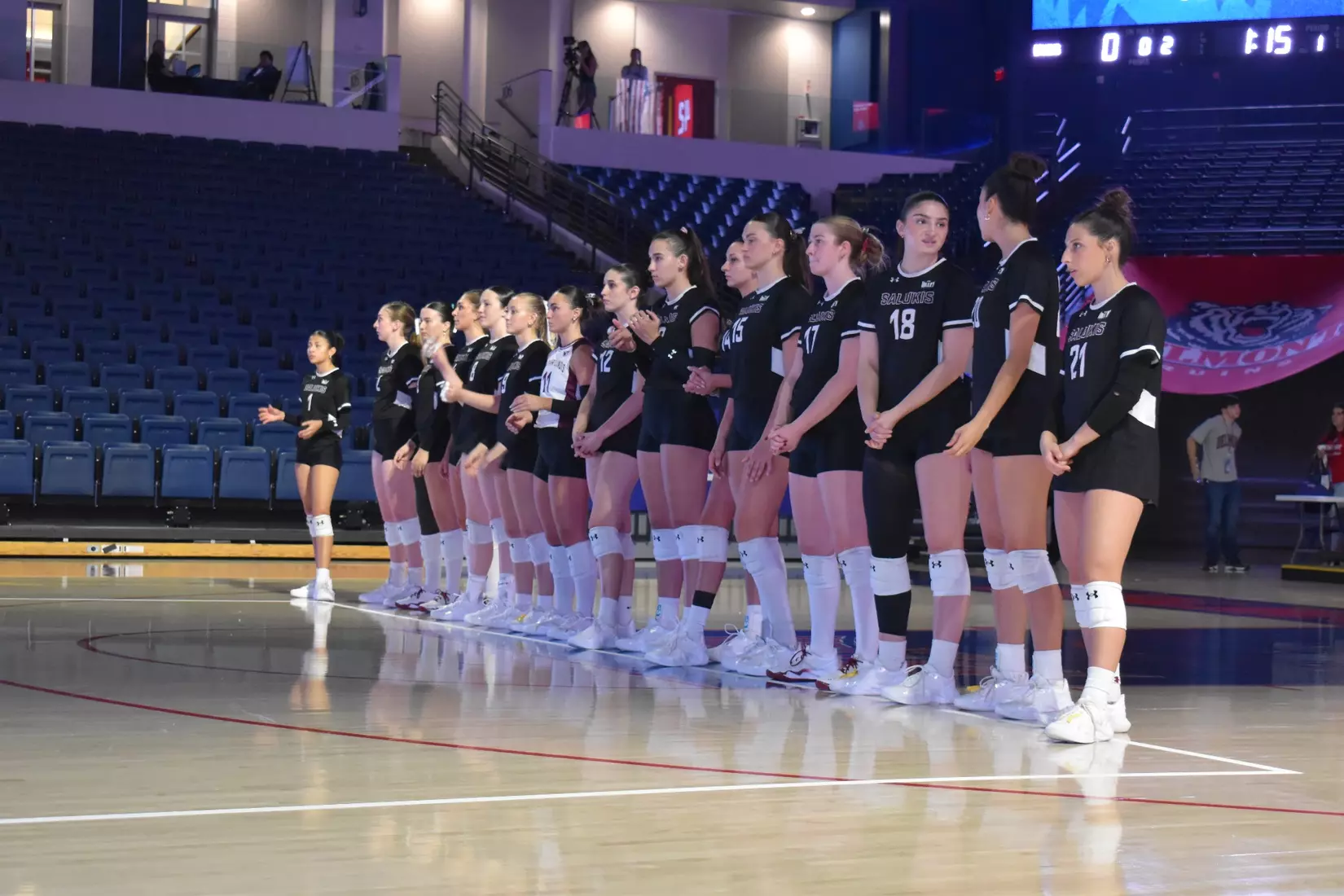 The team looks on during opposing introductions.
