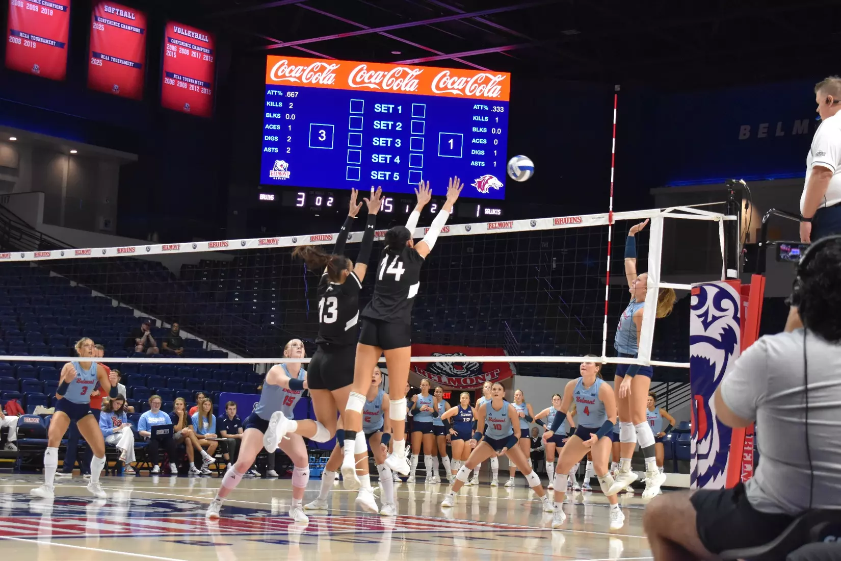Beatriz Piaia and Ella Swansiger block a ball.