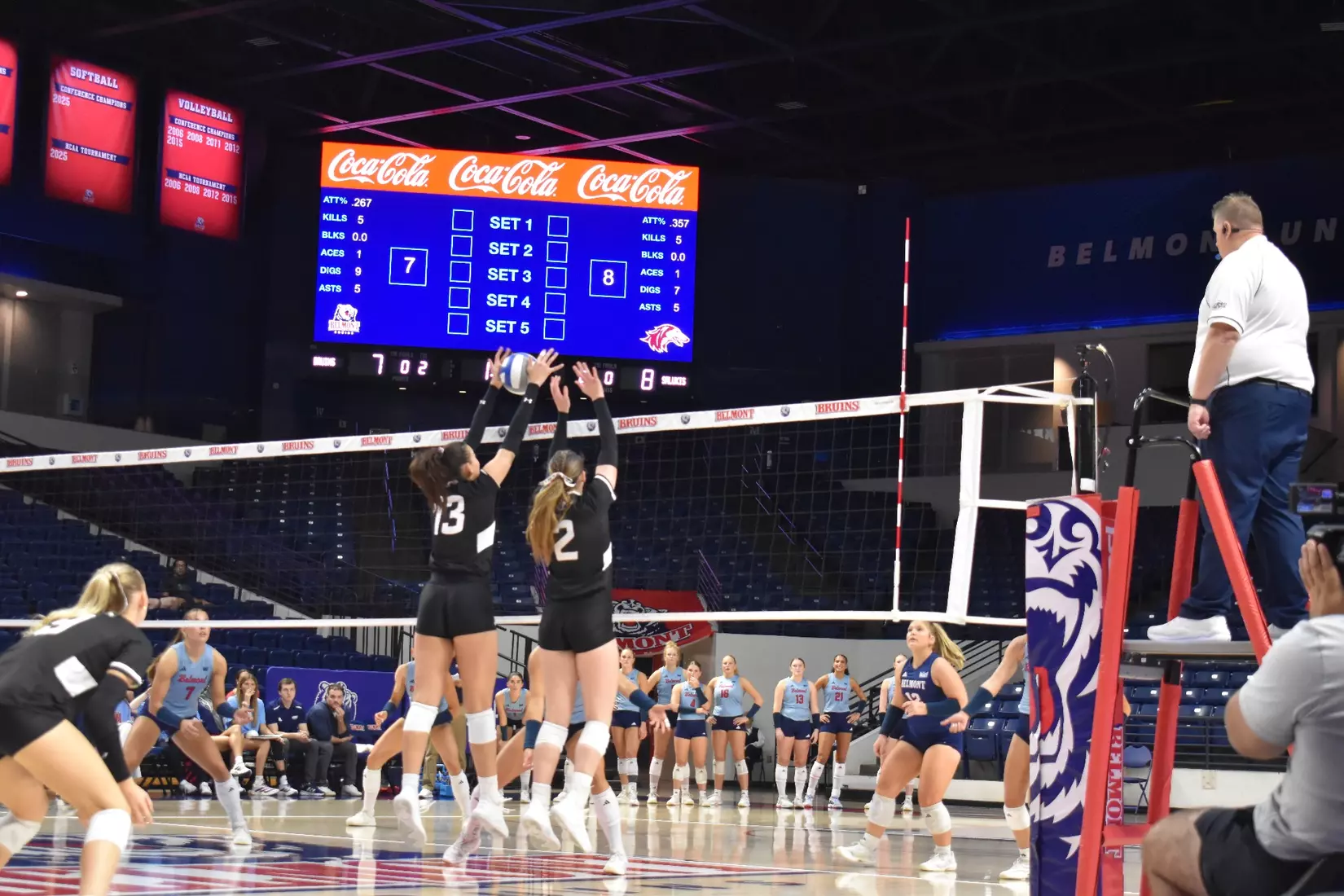 Beatriz Piaia and Natalie Vance block a ball.