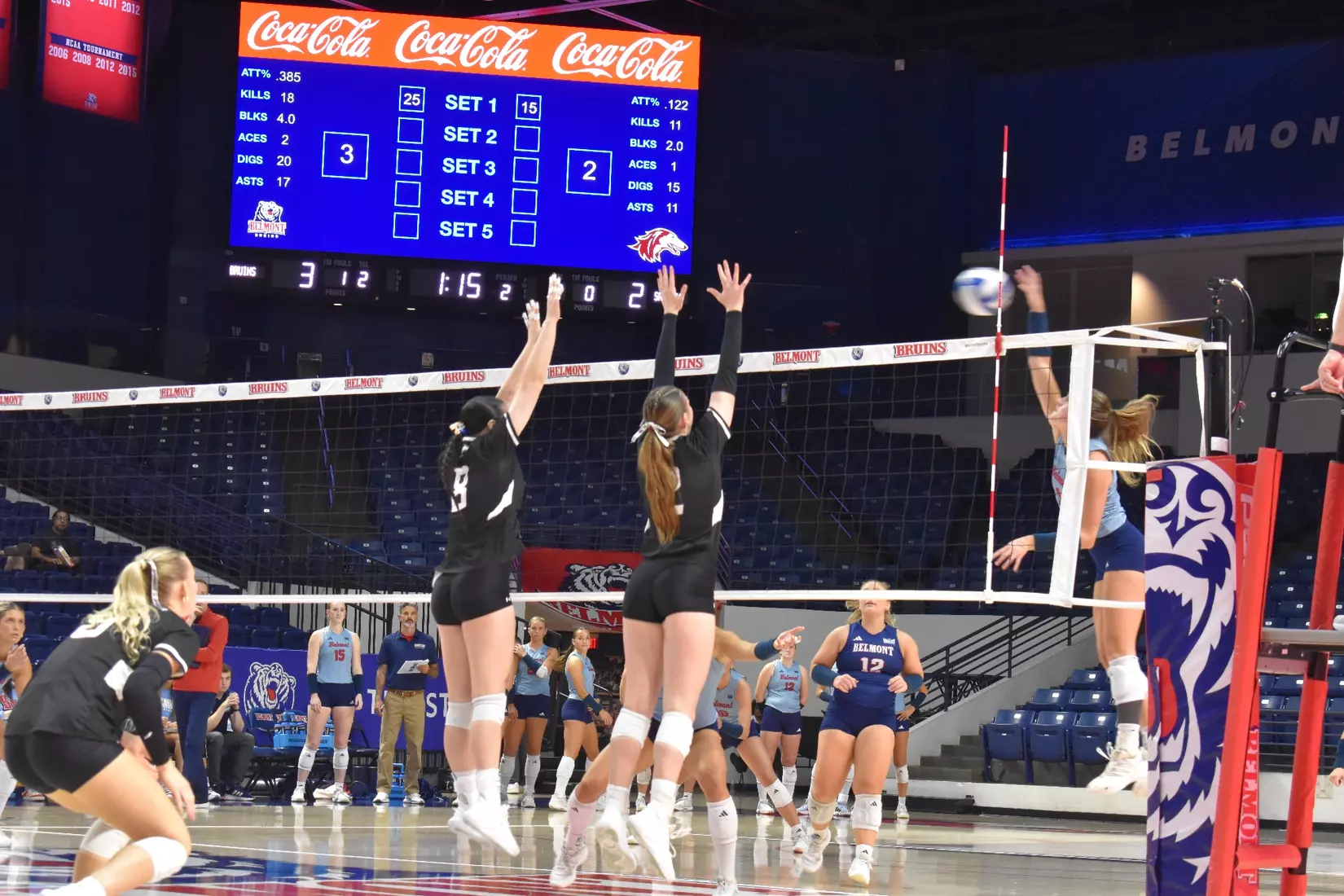 Alexandria Arrington and Natalie Vance block a ball.