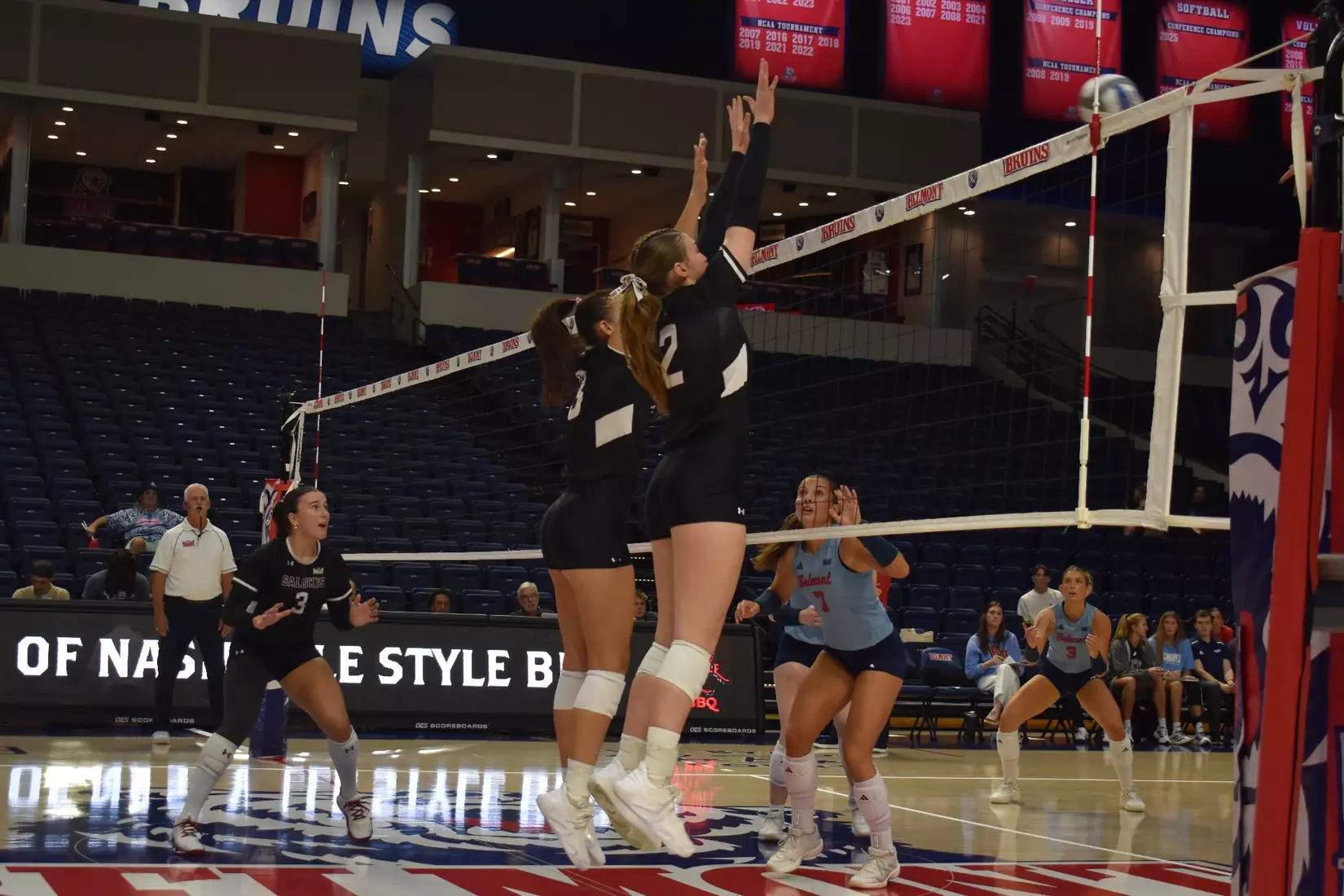 Beatriz Piaia and Natalie Vance block a ball.