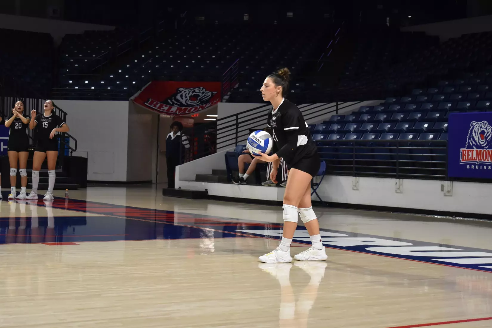 Isabella Del Real prepares to serve.