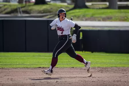 Emily Williams celebrates a home run against Bradley during SIU's 7-2 win in Game 1 at Charlotte West Stadium.