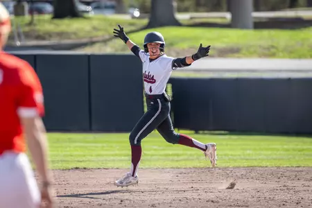 Amanda Knutson celebrates a home run during SIU's 15-0 (5) win against Bradley in Game 2 of a doubleheader on Friday, March 13, 2026.