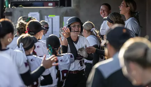 Delaney Osborne is embraced in the dugout during SIU's 15-0 (5) win against Bradley in Game 2 of a doubleheader on Friday, March 13, 2026.
