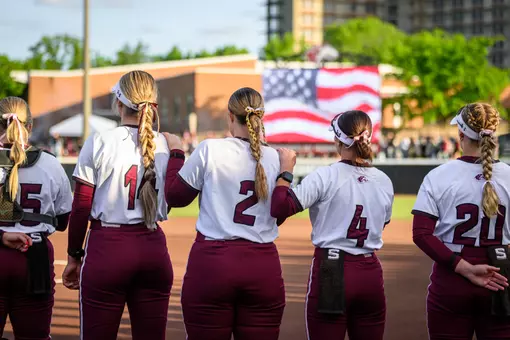 Southern Illinois lines up for the national anthem during its 10-1 (5) run-rule win over SIUE on Wednesday, April 29, at Charlotte West Stadium.