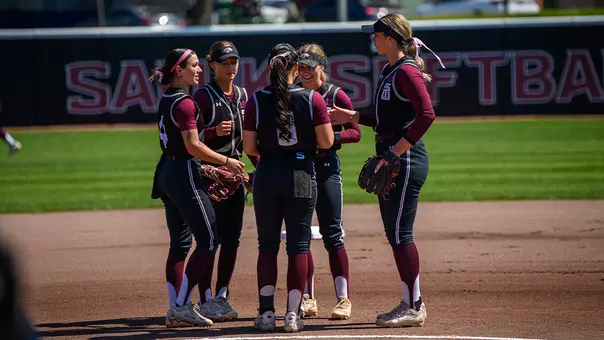 Salukis Huddle in the Circle