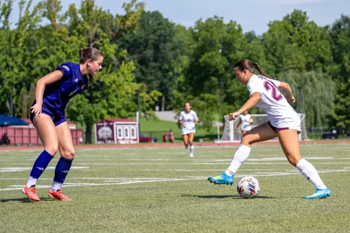 Celina Pinelli scissors the ball in an attempt to get around the Western Illinois defender.