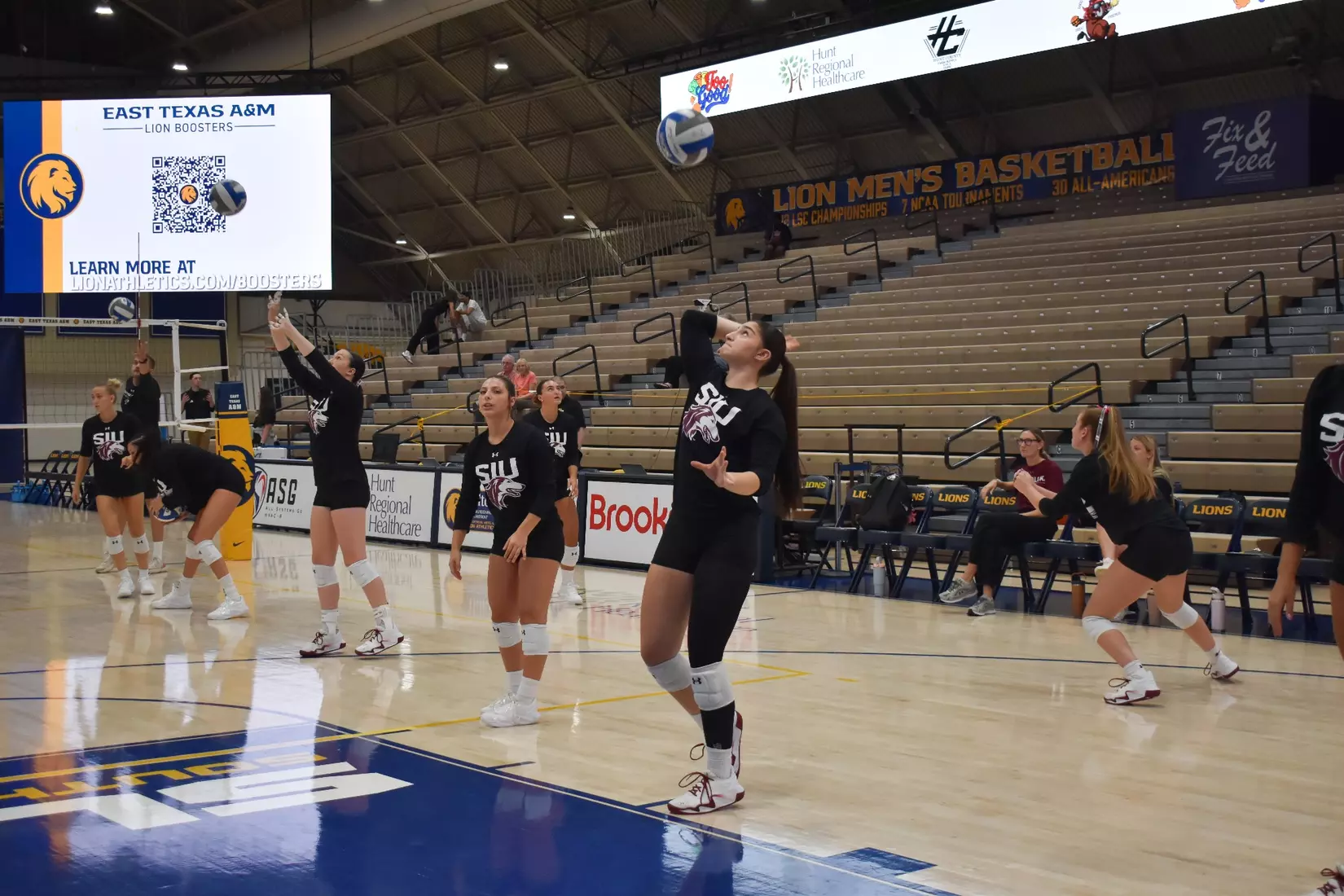 Una Stepic smacks a ball in warmups.
