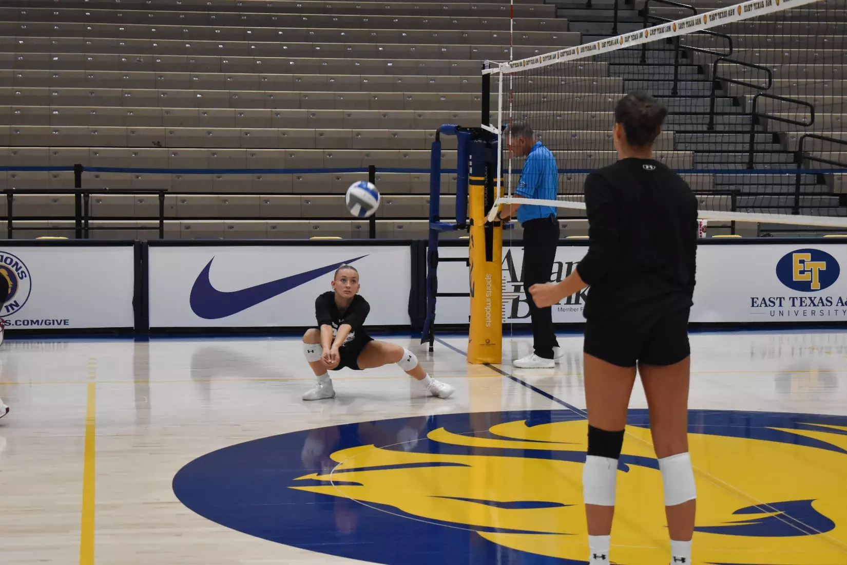 Lillian Dempkey bumps a ball in warmups.