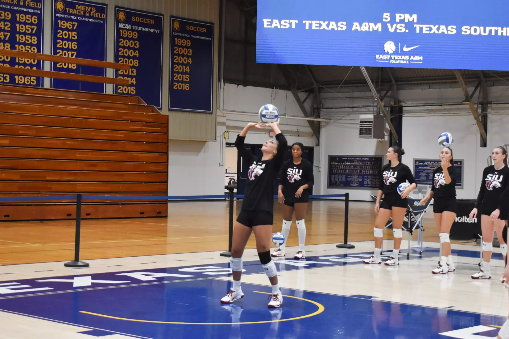 Ella McFarland sets a ball pregame.