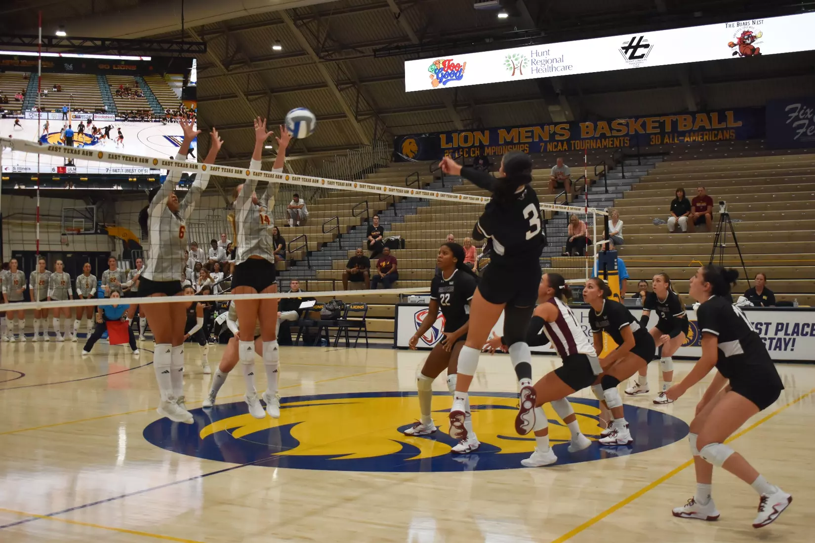 McKenzie Moeller sends a ball flying over the net.