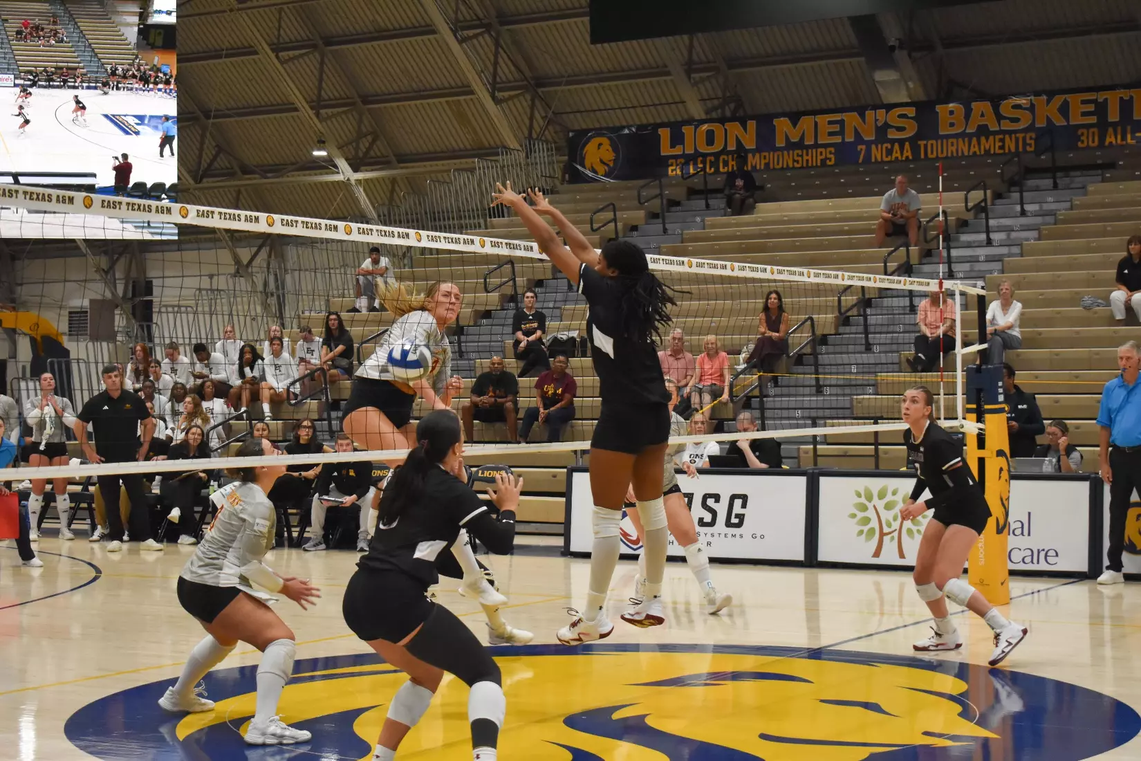 Chloe Anderson jumps up and rejects a UL Monroe attack.