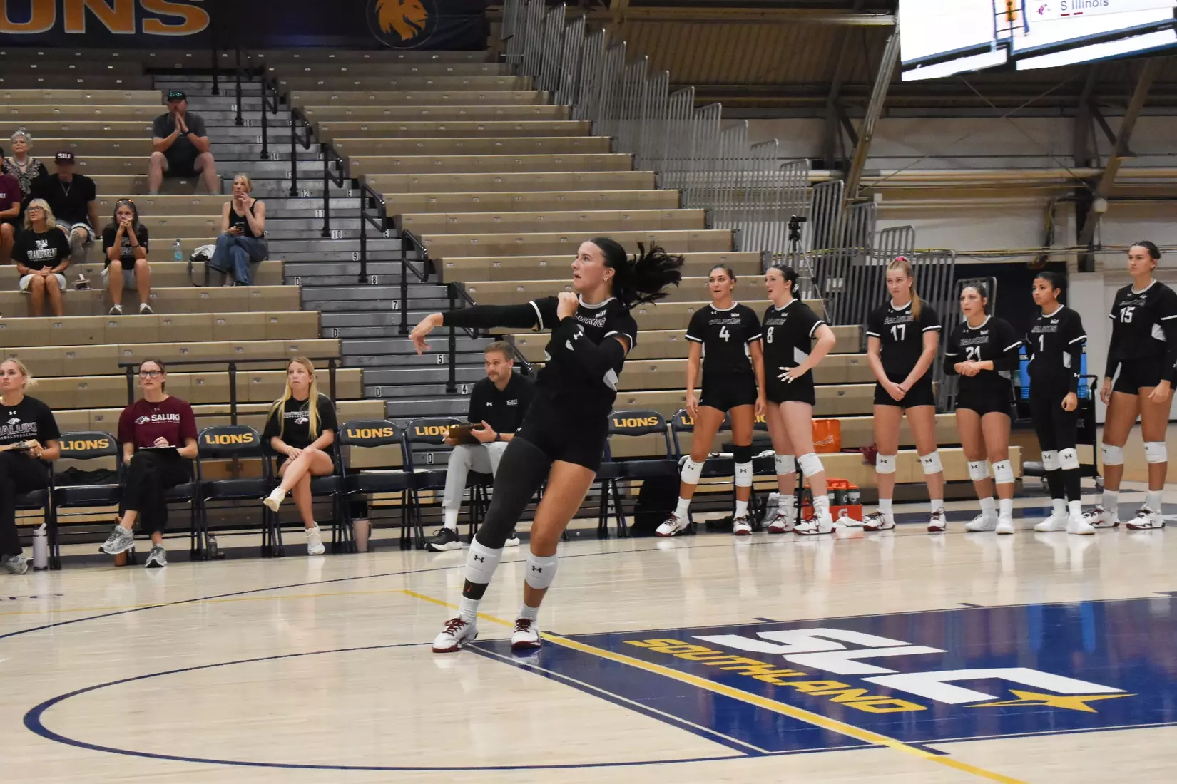 McKenzie Moeller follows through on a serve.