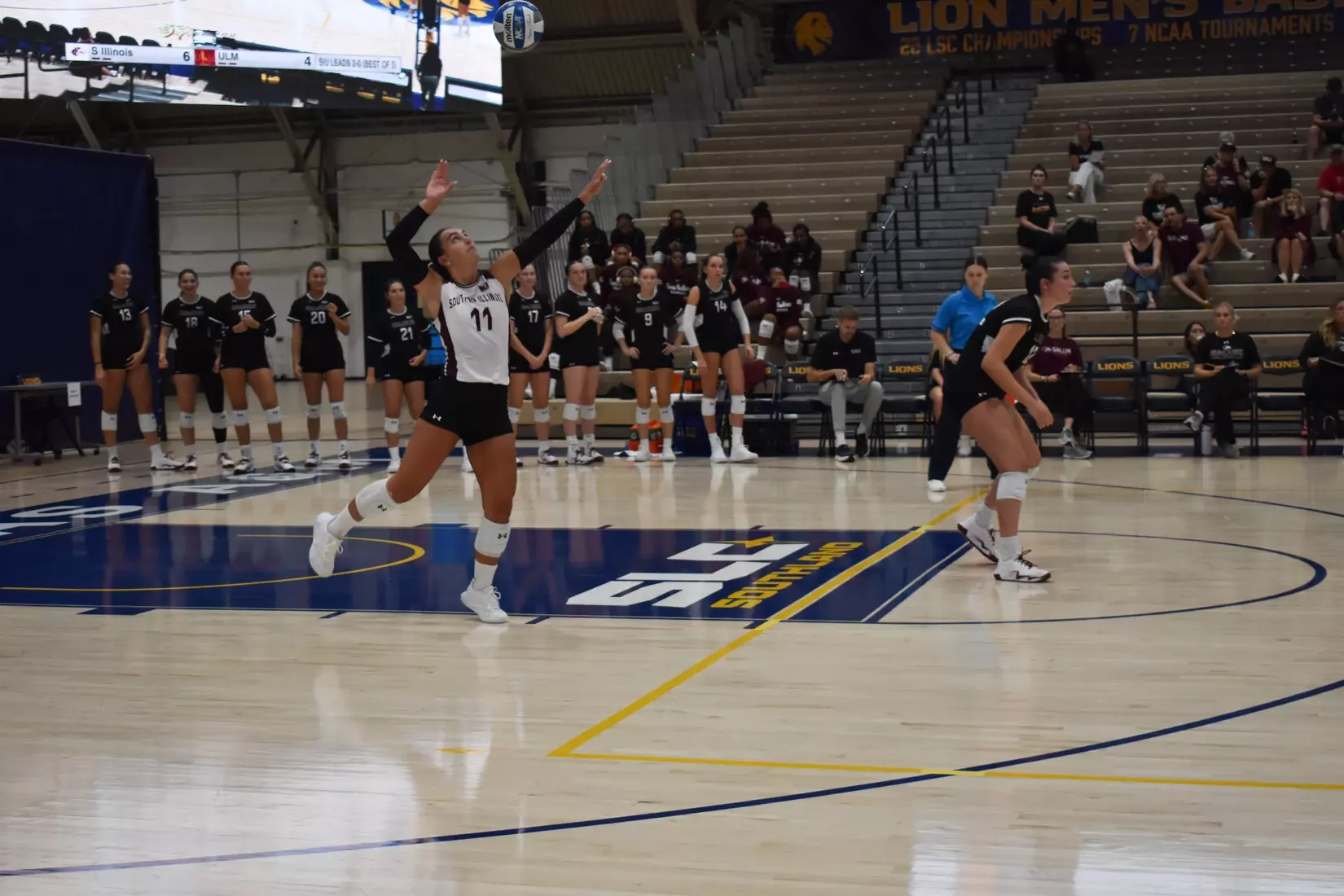 Jillian Shaneyfelt prepares to take air in the middle of her serve.