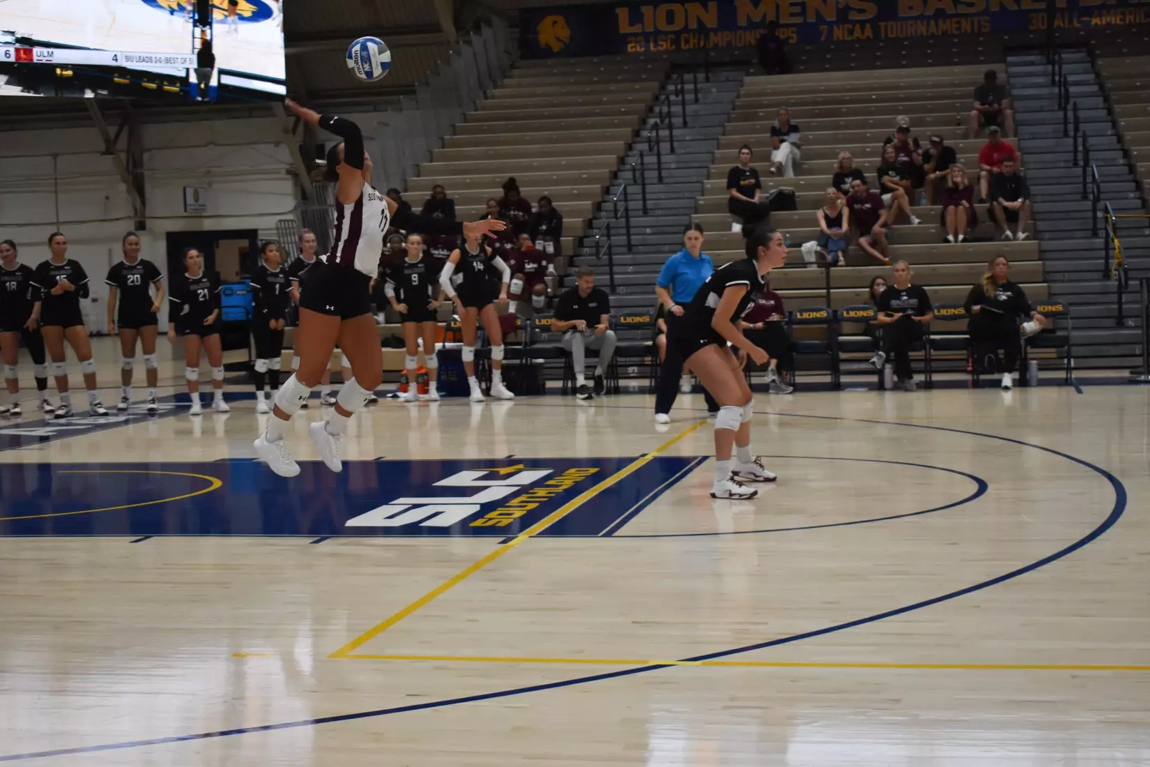 Jillian Shaneyfelt serves a ball in the match.