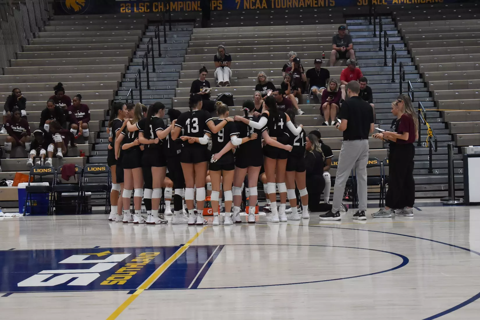 The team huddles up during a timeout.