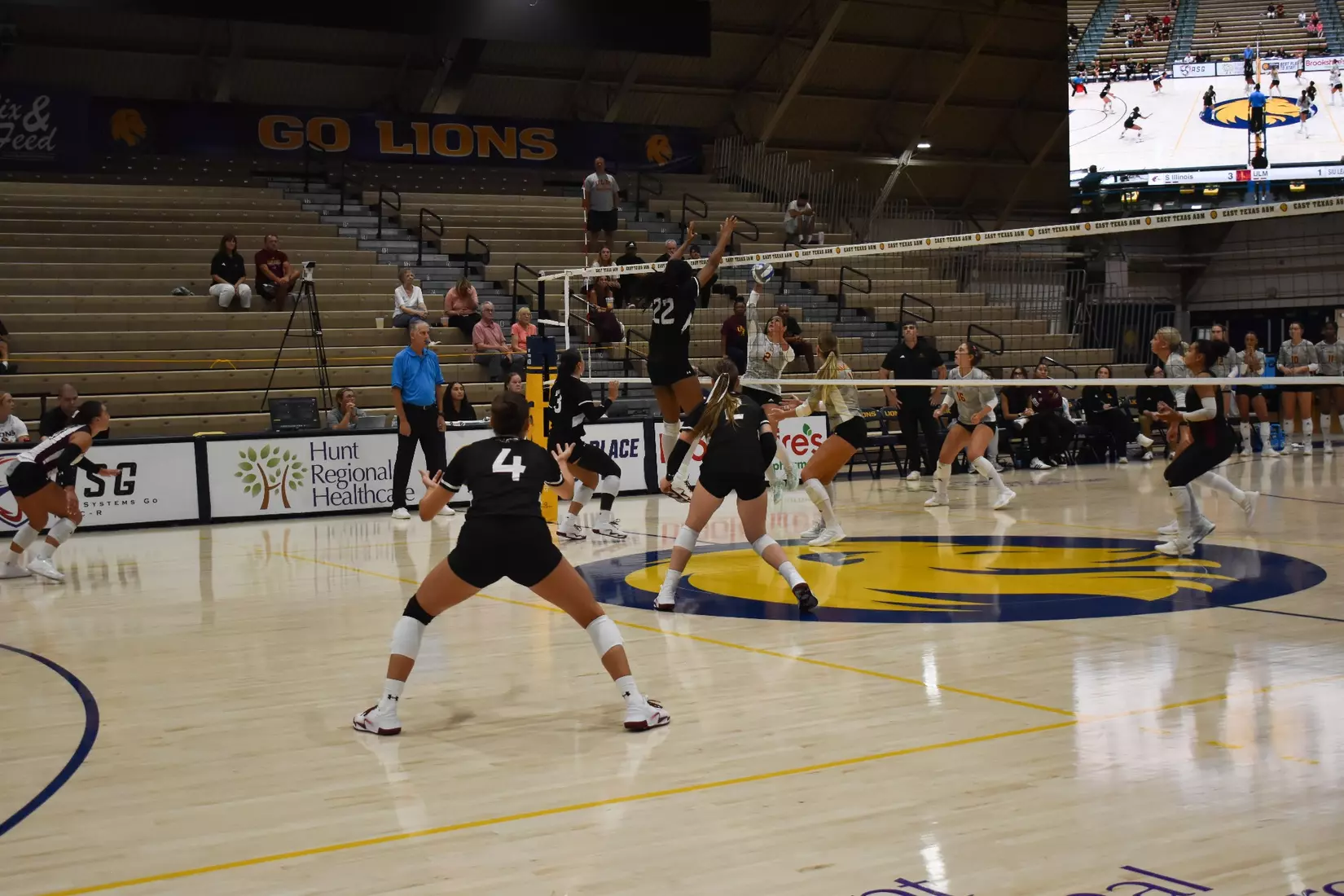 Chloe Anderson jumps up for a block.