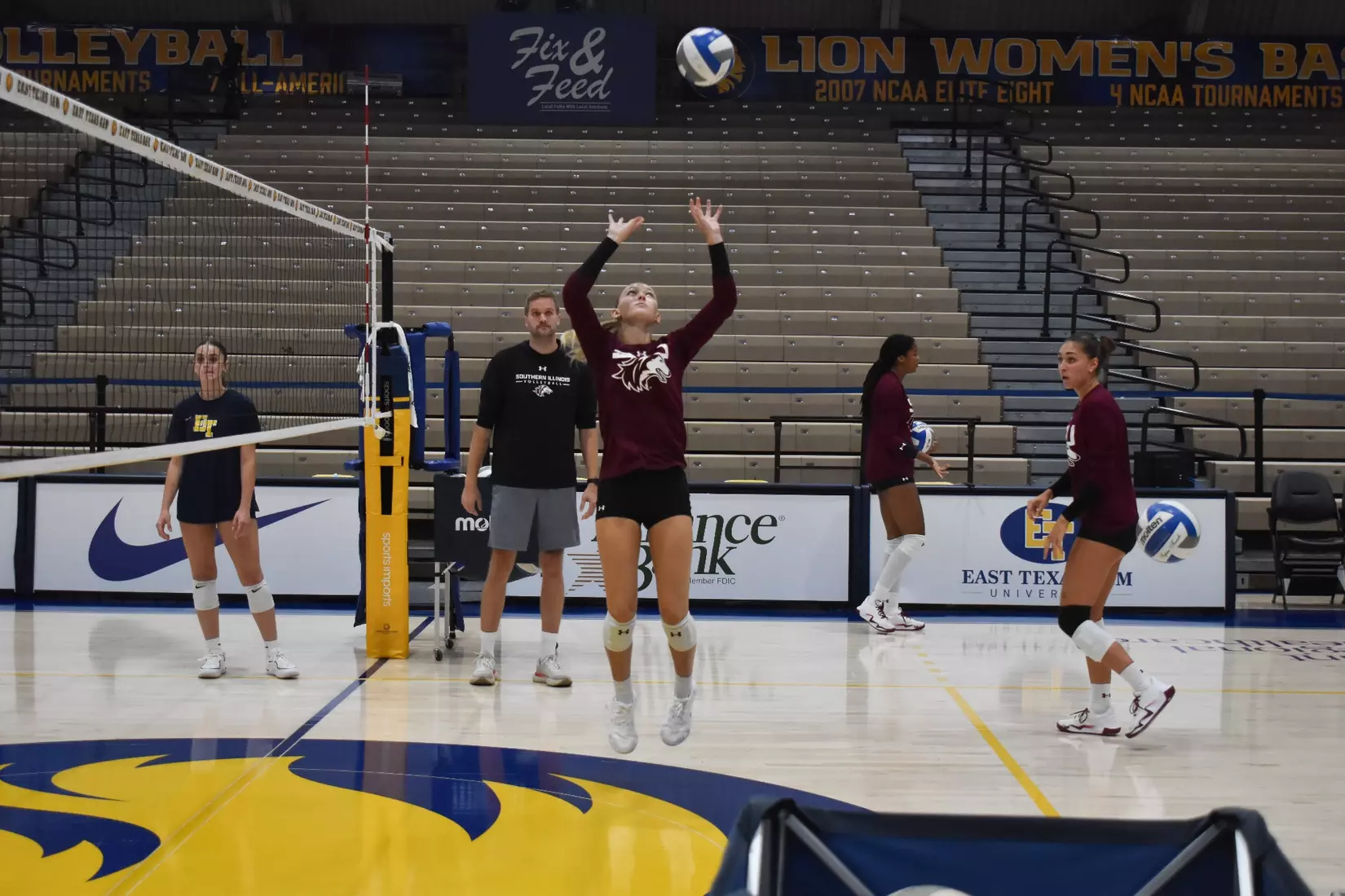 Lillian Dempkey sets a ball in warmups.