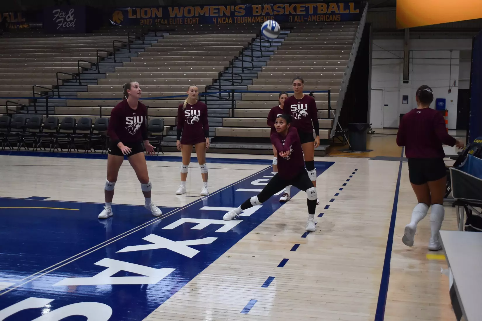 Dafne Sosa bumps a ball in warmups.