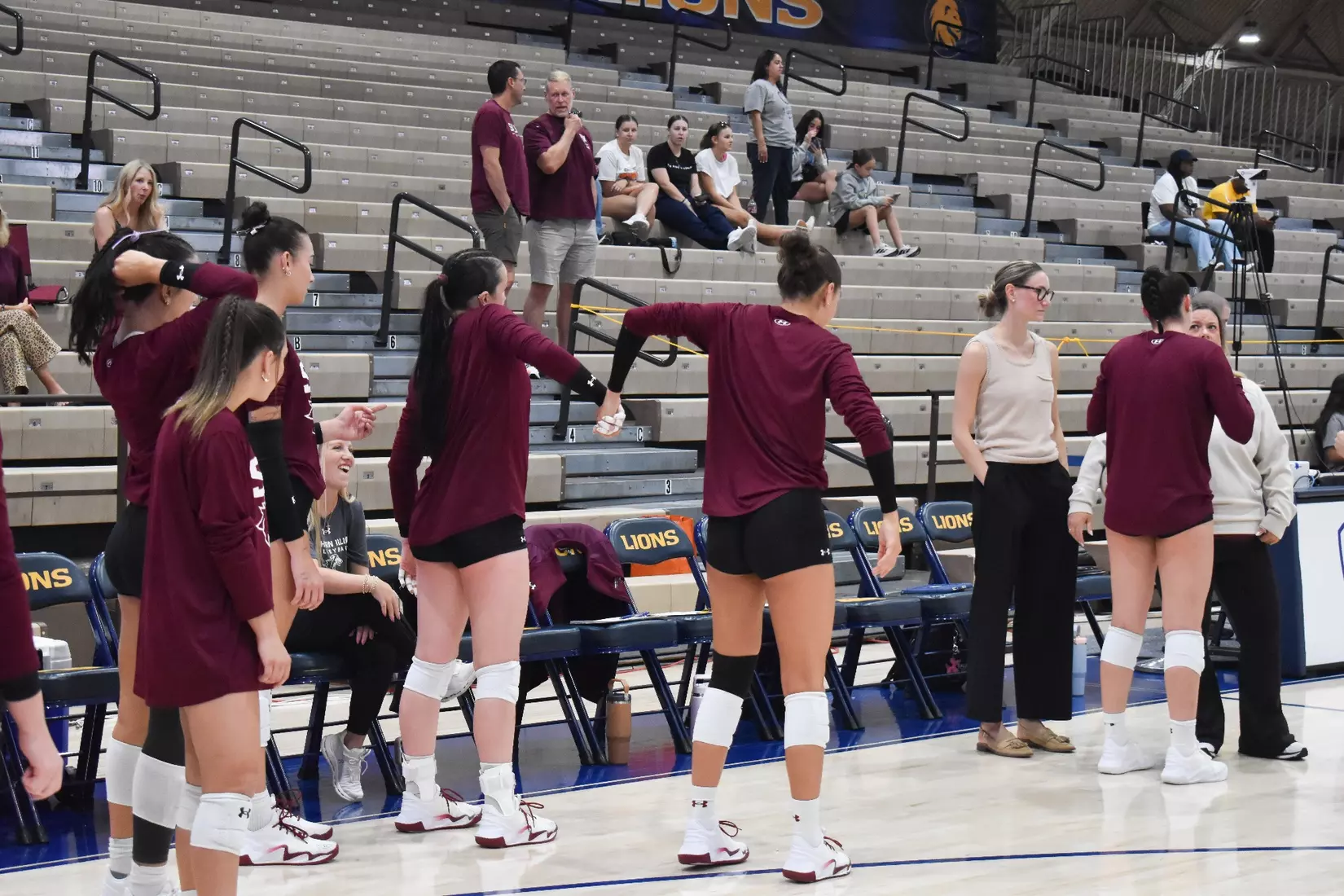 Ella McFarland and Alexandria Arrington dance in warmups.
