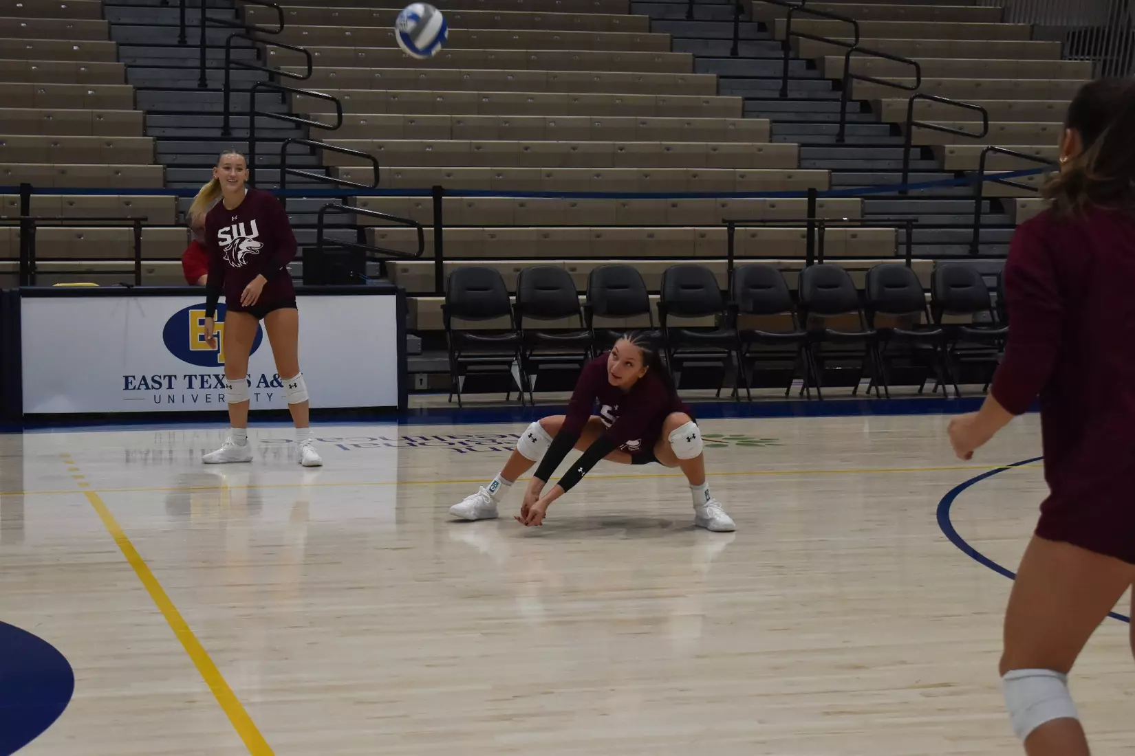 Ella Swansiger bumps a ball in warmups.