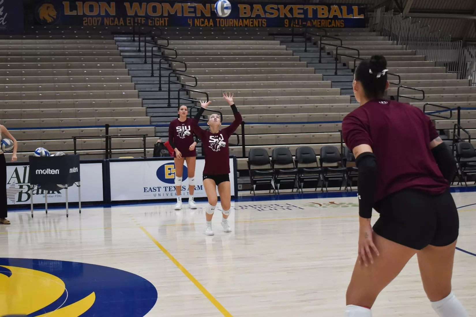 Lillian Dempkey sets a ball in warmups.