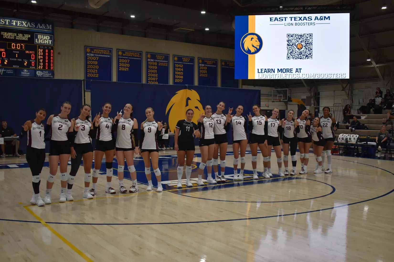 The team smiles for a picture prior to the start of the match.