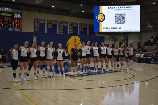 The team smiles for a picture prior to the start of the match.