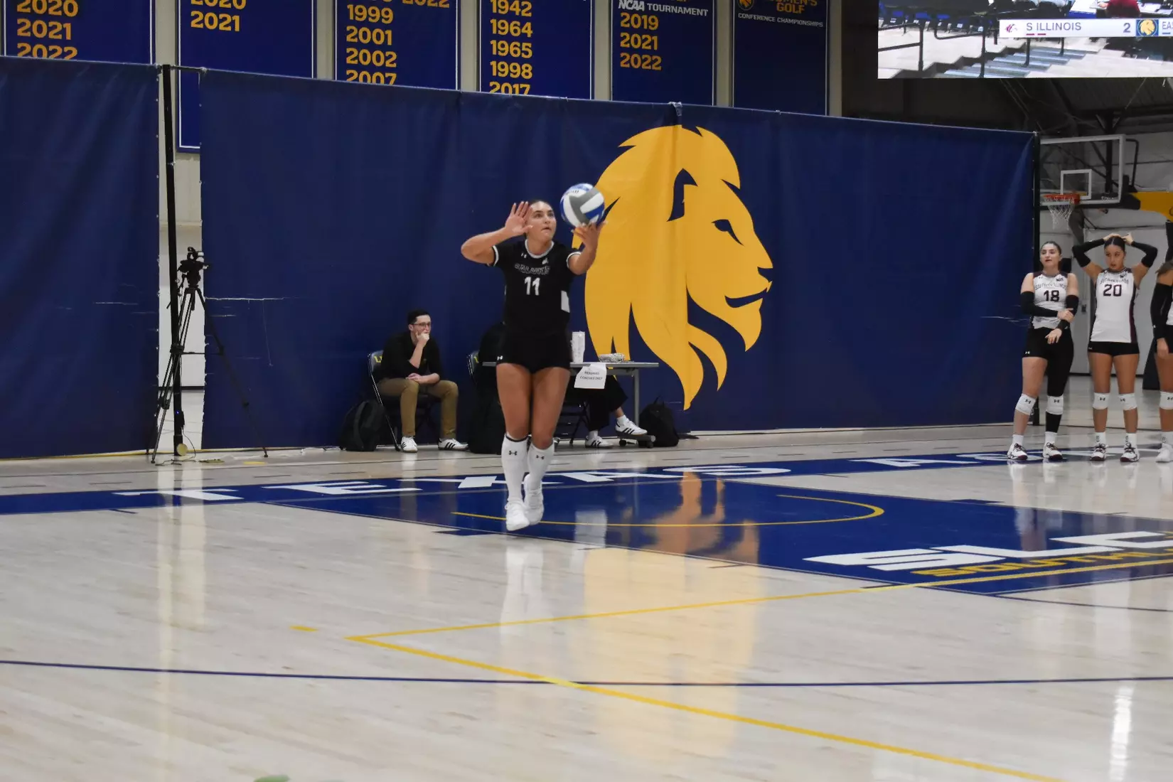 Jillian Shaneyfelt prepares to serve a ball in the match.