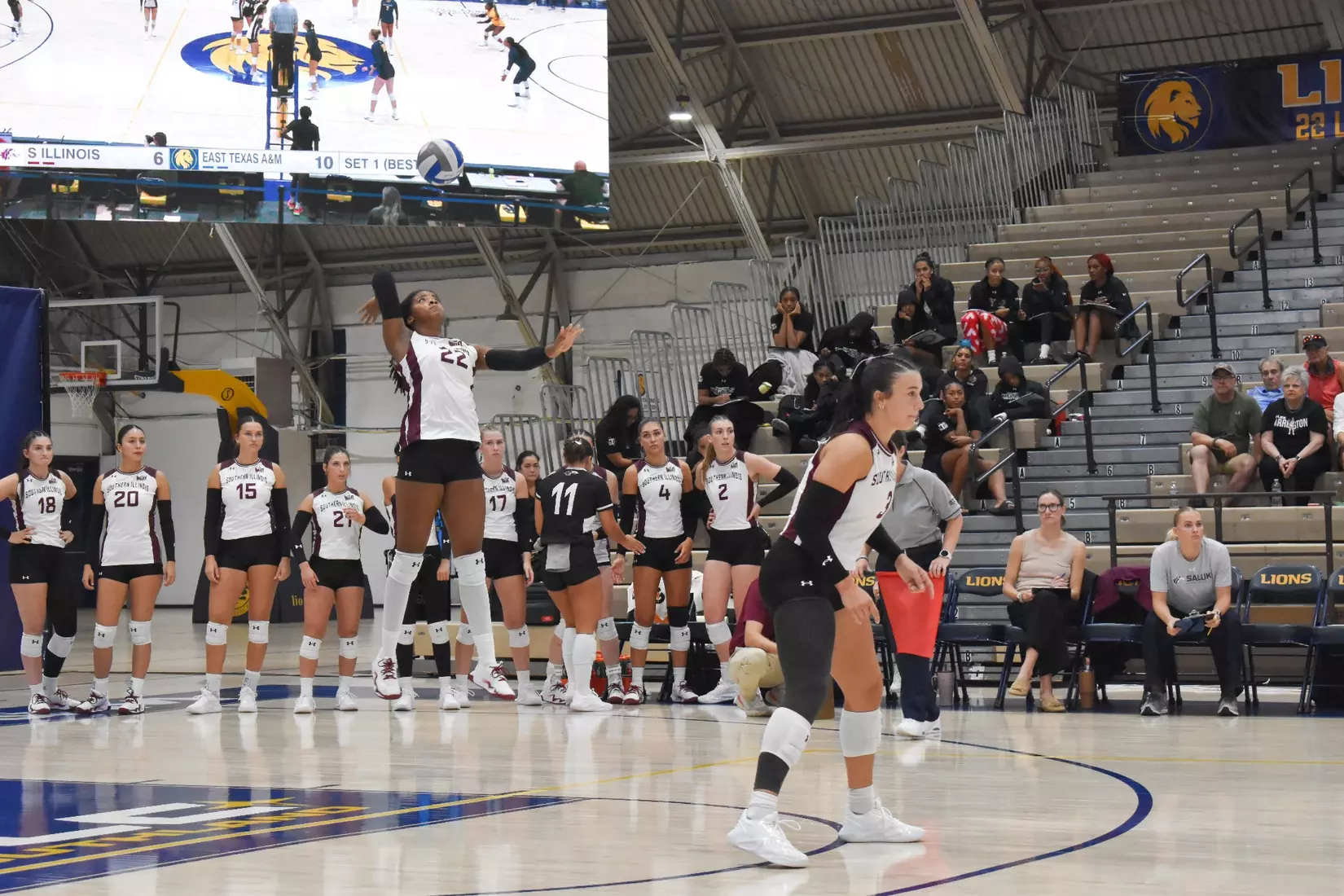 Chloe Anderson serves a ball in the match.