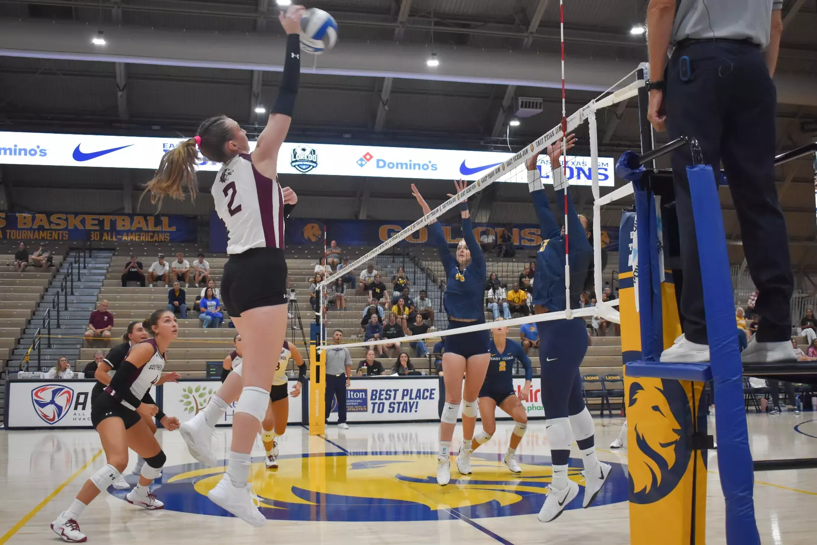 Natalie Vance smacks a ball over the net.