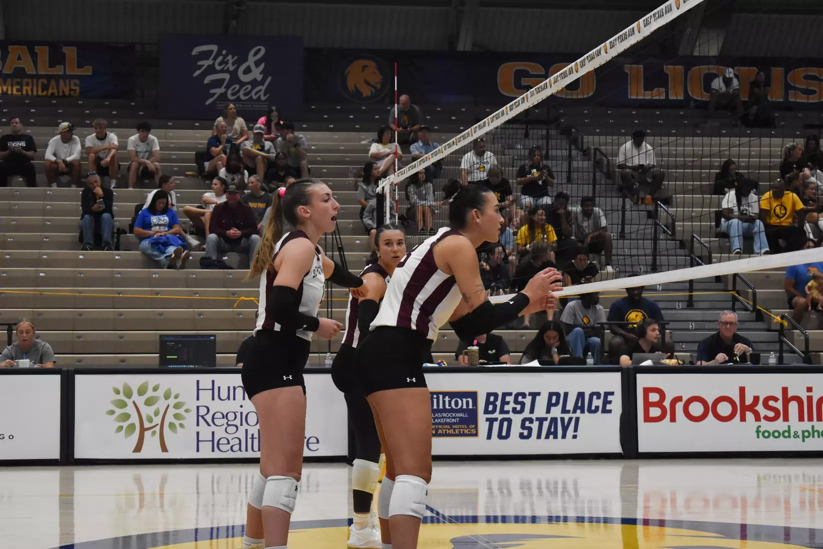 Natalie Vance directs the Salukis behind Beatriz Piaia prior to a serve.