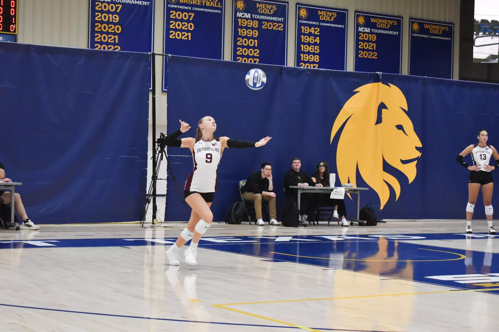 Lillian Dempkey tosses a ball in the beginning of her serve,