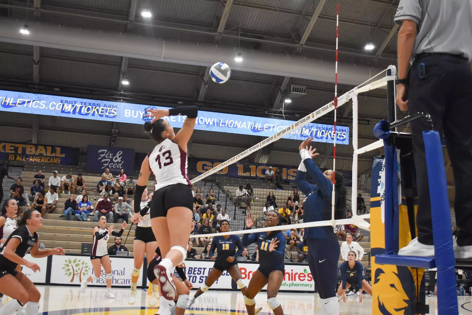 Beatriz Piaia smacks a ball over the net.
