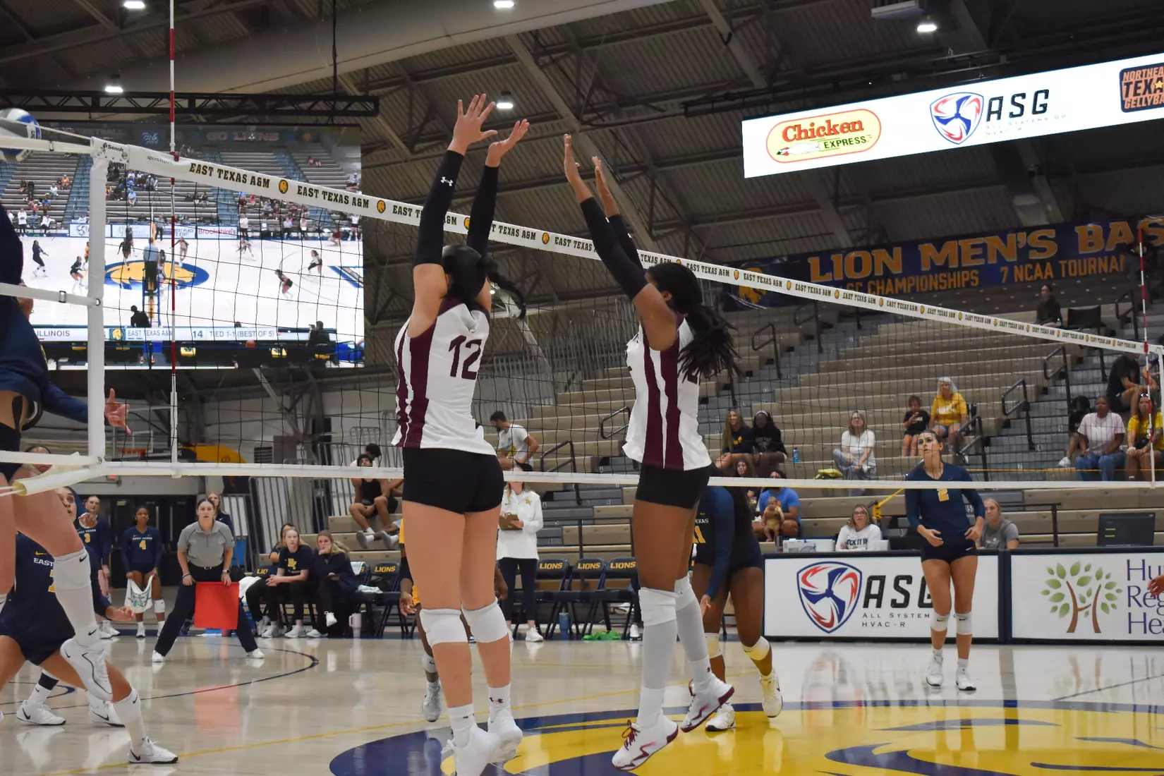 Carlota Mora and Chloe Anderson go up for a block.
