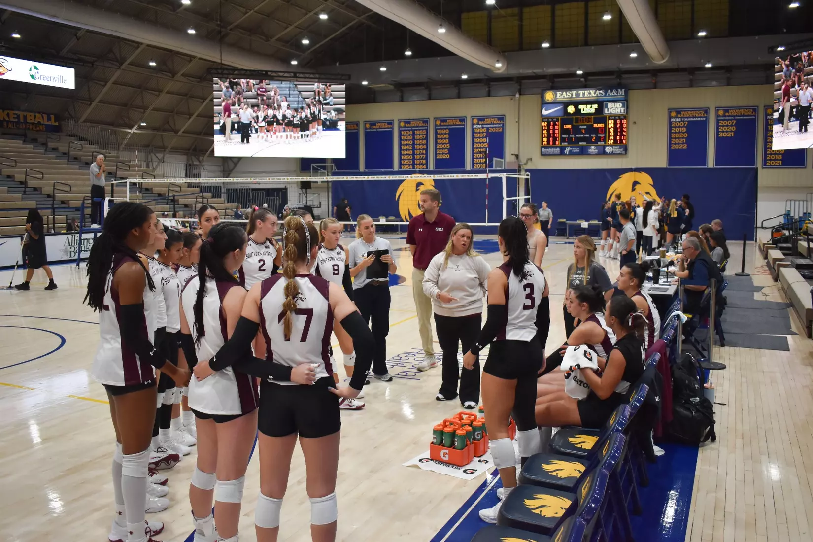 Head Coach Brittany Harry talks to her team during a timeout.