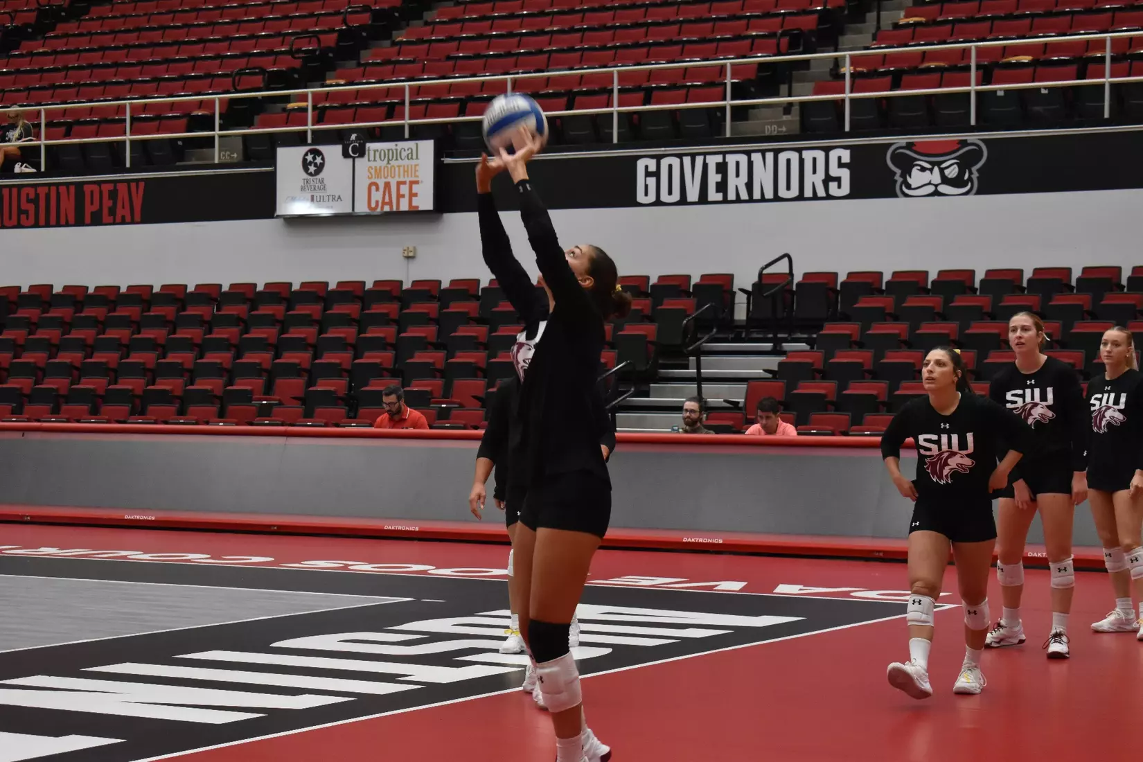 Ella McFarland sets a ball in warmups.