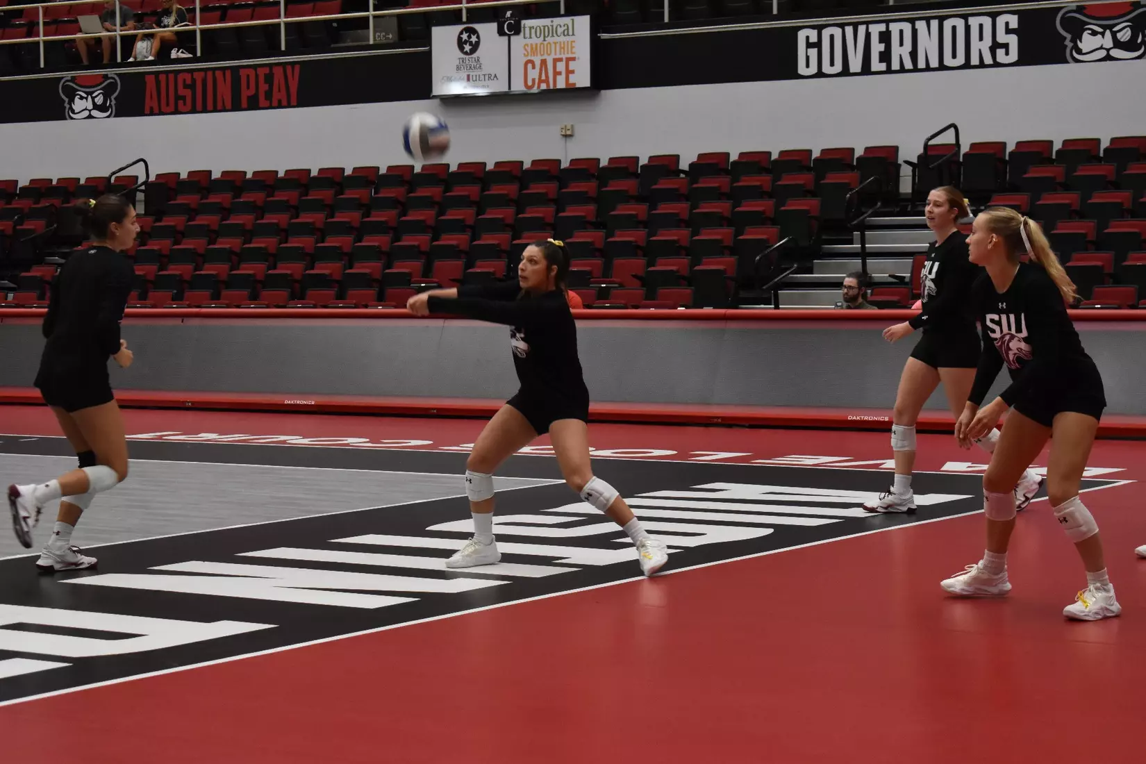 Isabella Del Real bumps a ball in warmups.