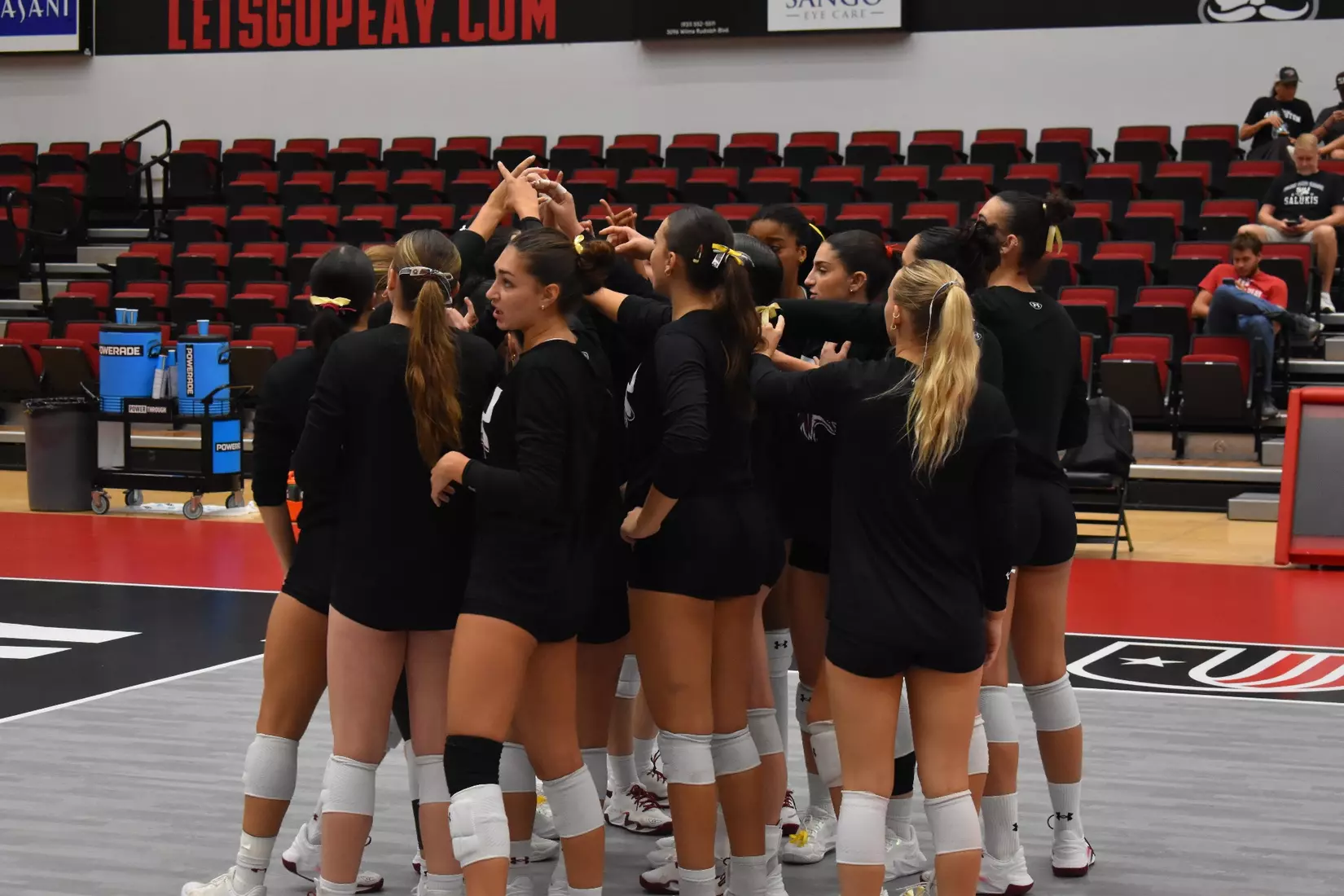 The team huddles in warmups.