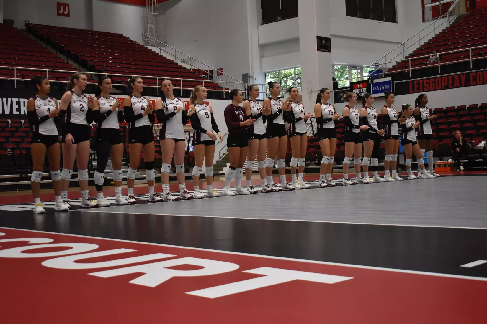 The team claps for opposing lineups.