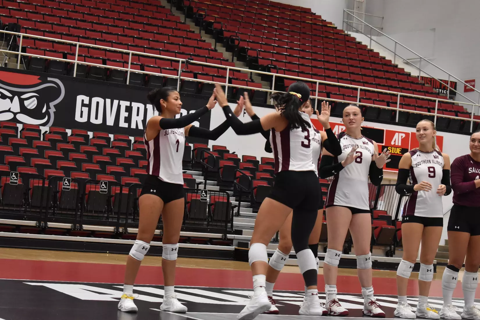 McKenzie Moeller high fives Dafne Sosa as her name is announced.