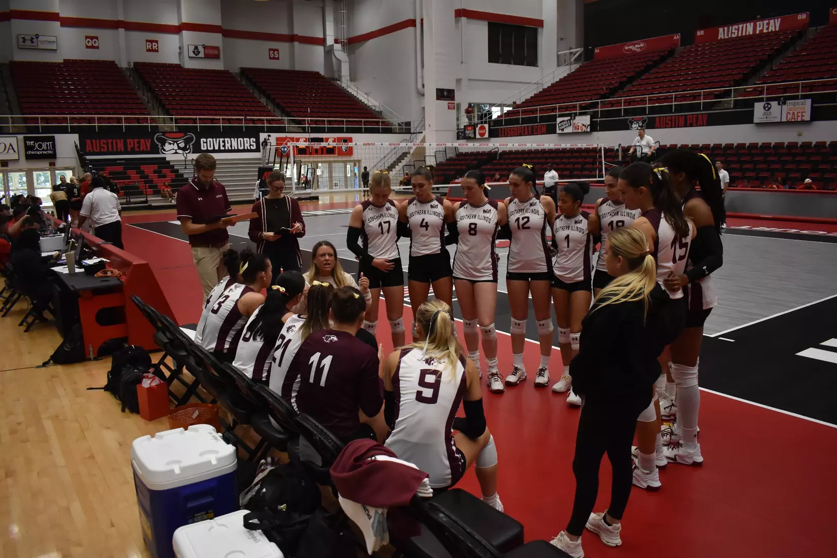 Head Coach Brittany Harry talks to her team during a timeout.