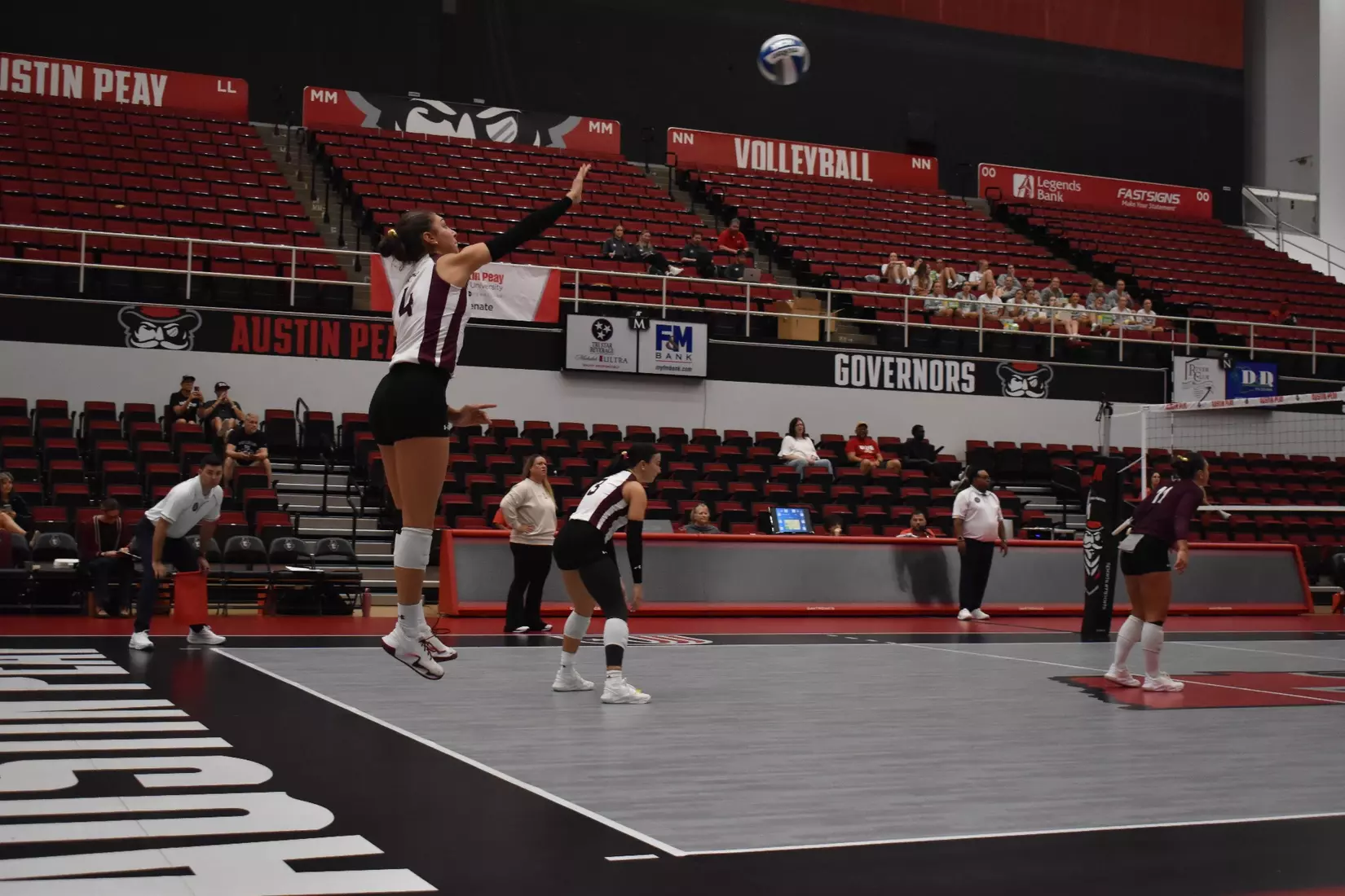 Ella McFarland follows through on her serve.
