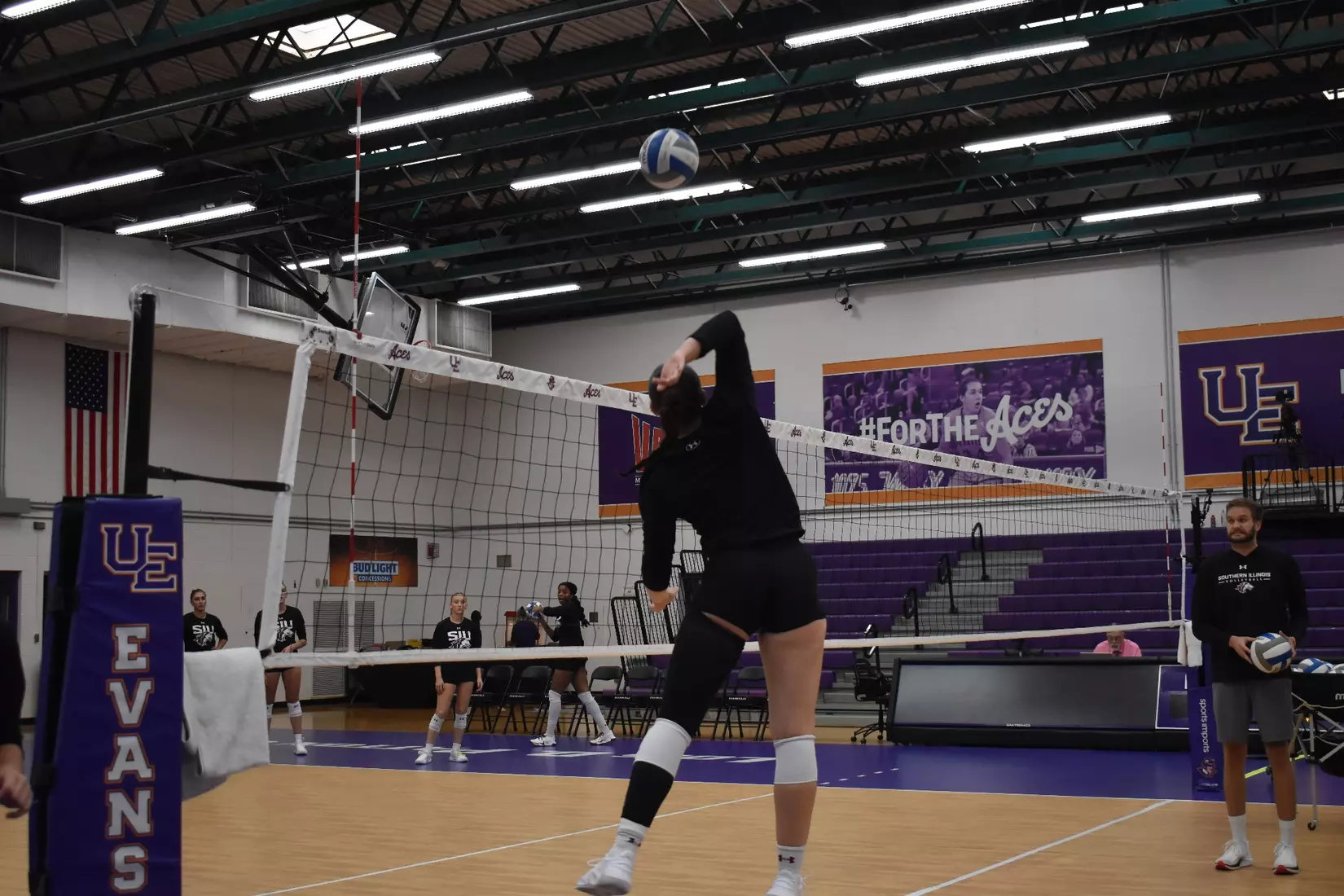 Una Stepic attacks a ball in warmups.