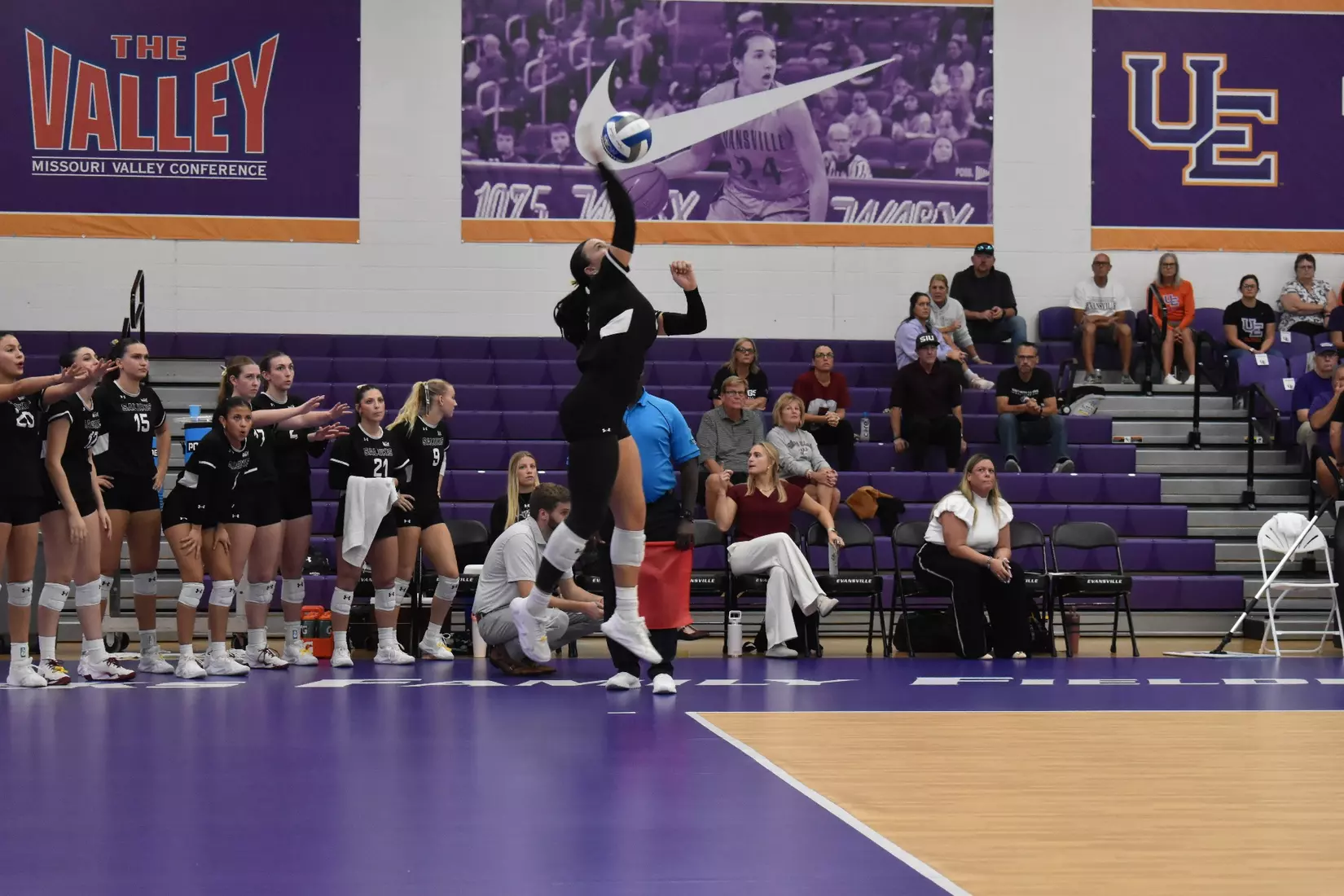 McKenzie Moeller serves a ball in the match.